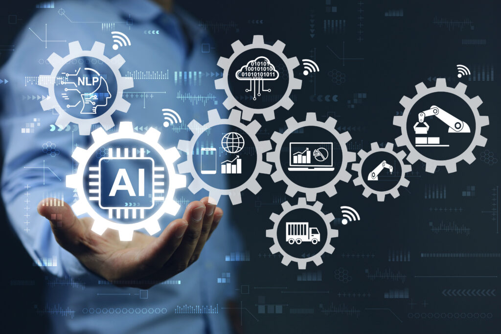 Businessman hand holding gears of ai or artificial intelligence - IGNITE Marketing Group